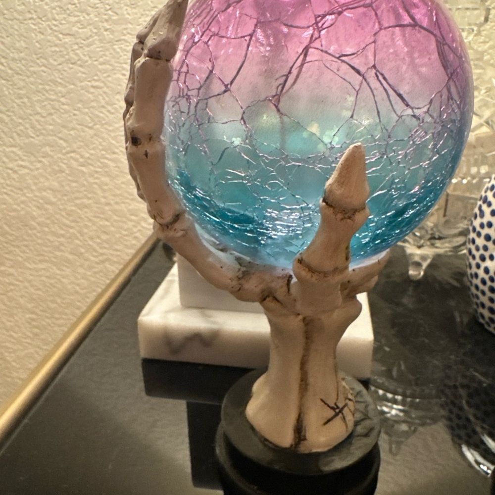 Pink and Blue Crackle Glass Globe on Skeleton Hand Stand halloween
